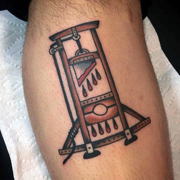 Traditional-style guillotine tattoo with bold outlines, dripping blood, and red shading around the blade and headrest area.