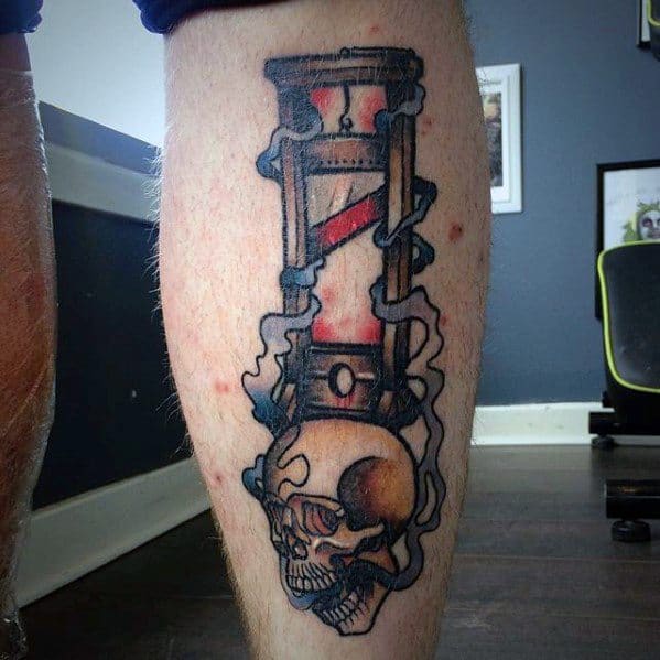 Bold guillotine tattoo with red blade detail, dark smoke-like shading, and a realistic skull emerging from the base.
