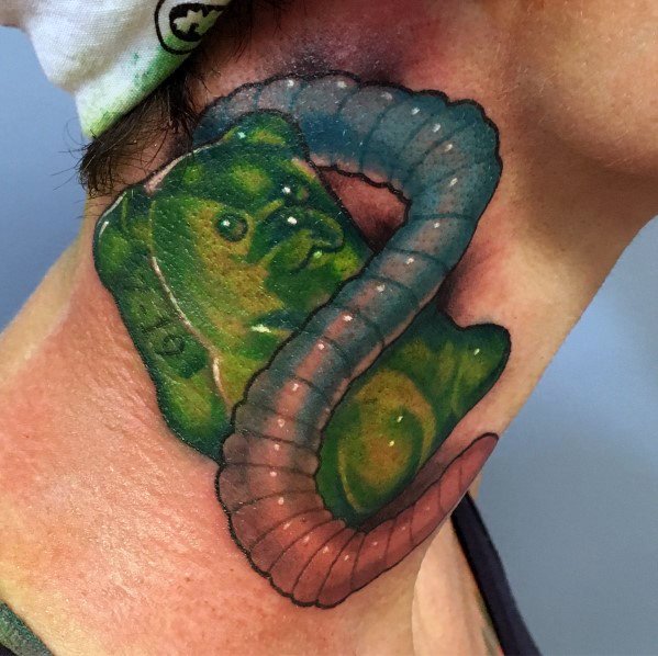 Realistic gummy bear and gummy worm tattoo with vibrant colors and shading, creating a bold 3D effect on the neck.