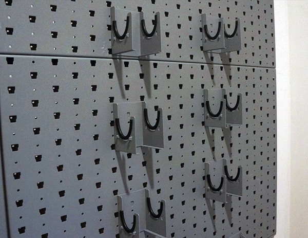 gun room wall with pistol handgun hangers
