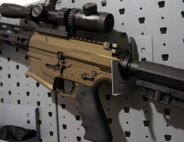 gun safe with wall display of rifle