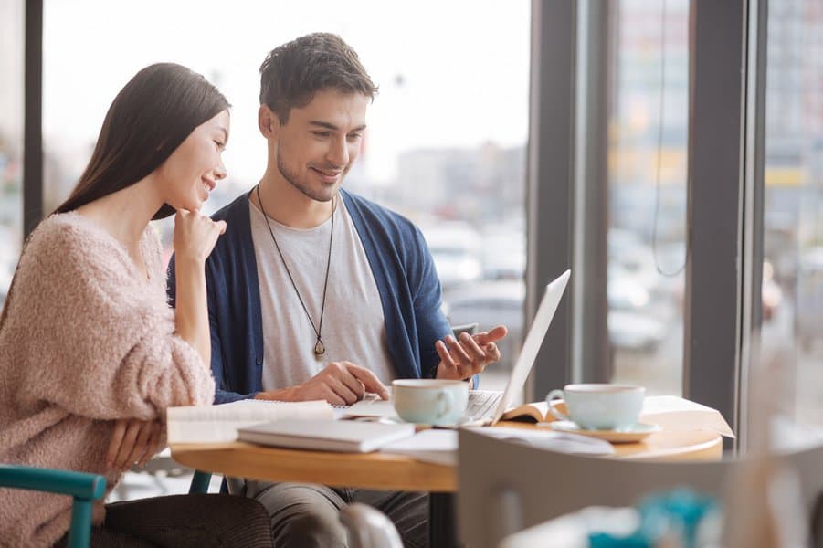 Young guy and woman working togetherYoung guy and woman working together