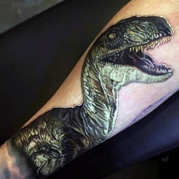 Guy With 3D Dinosaur Tattoo On Forearms