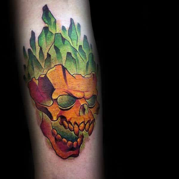 Guy With 3d Colorful Glowing Green Orange Skull Tattoo On Arm