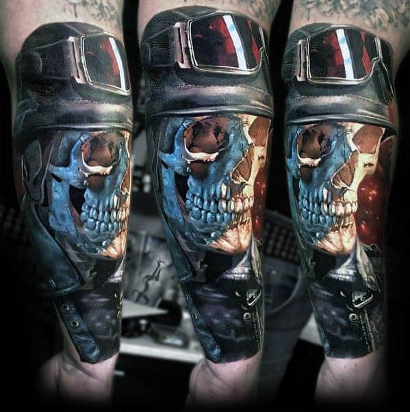 Tattoo of a skull wearing a helmet with goggles on a forearm