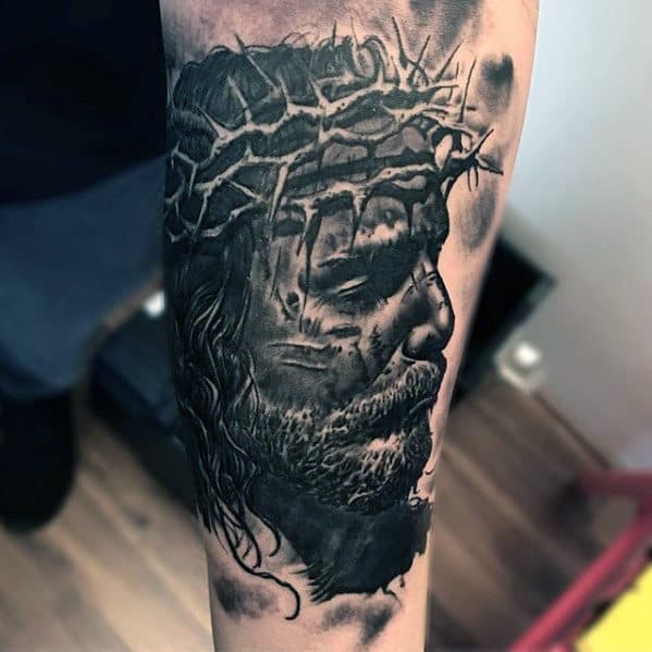 Guy With 3d Jesus Face Tattoo On Inner Forearm