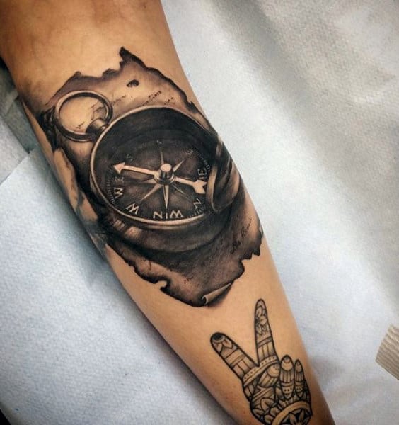 Guy With 3d Nautical Compass Tattoo On Forearm