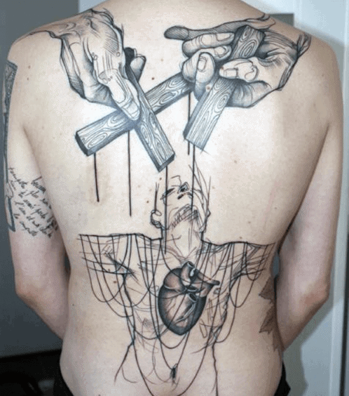 Guy With Abstract Cross Tattoo