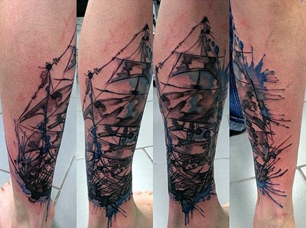 Guy With Abstract Watercolor Tattoo On Calves