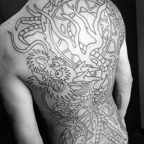Guy With Amazing Full Back Black Ink Outline Traditional Dragon Themed Tattoo