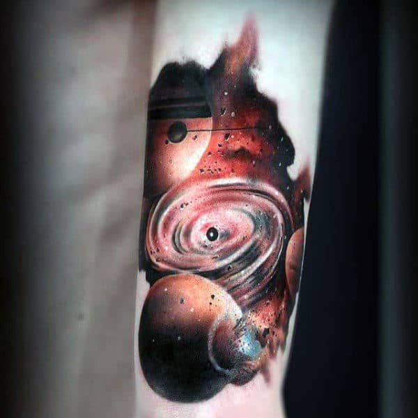 Guy With Amber Colored Universe Tattoo On Forearms