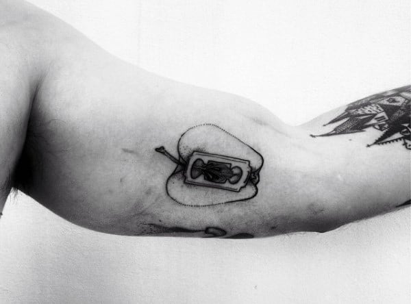 Guy With Apple Razor Blade Arm Tattoo