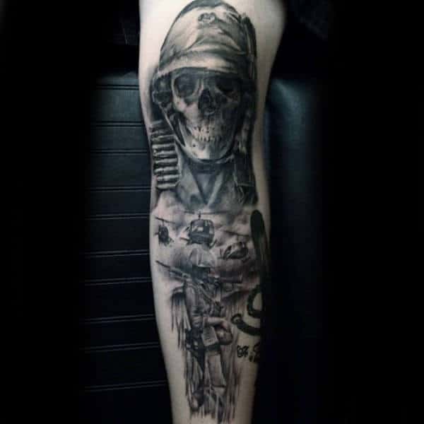 Guy With Armed Themed Leg Tattoo Skull Design