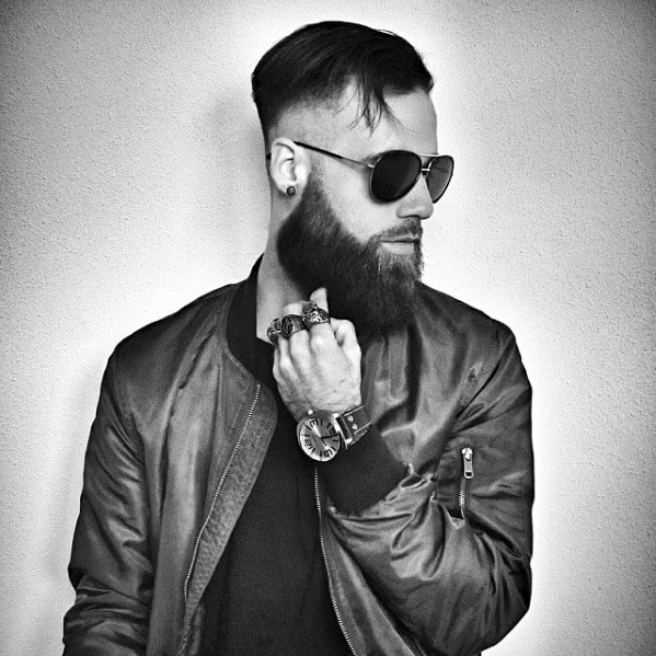 undercut hairstyle with thick beard