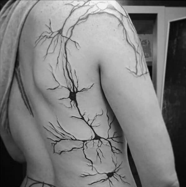 Large neuron tattoo design spanning the back and arm, featuring multiple interconnected neurons with fine branching dendrites.