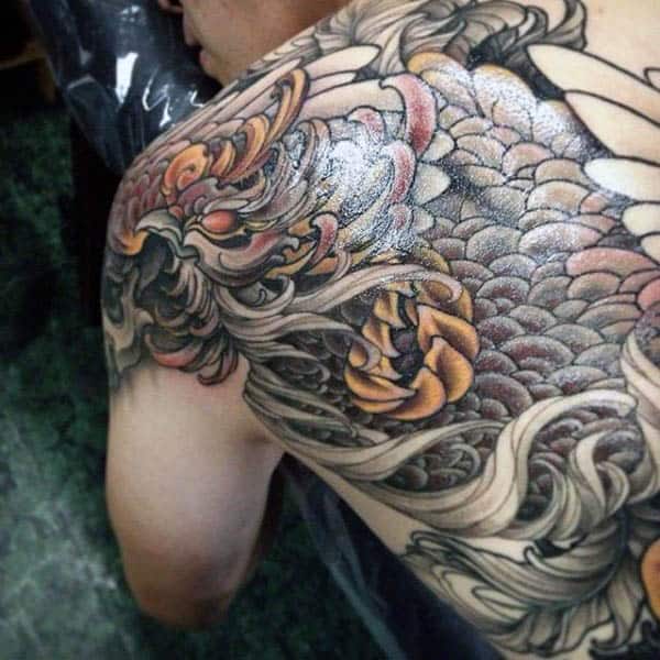 Guy With Back Tattoo Of Mythological Phoenix Bird Design