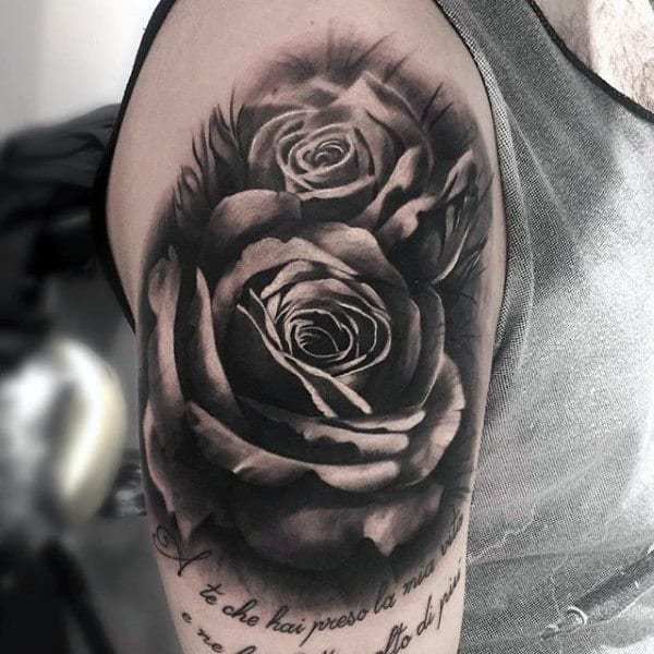Guy With Black And Grey Pair Of Roses And Quotes Tattoo On Arms