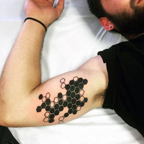 Guy With Black Honeycomb Tattoo Arms