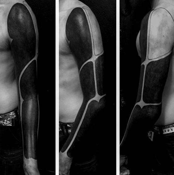 Guy With Blackout Sleeve Tattoo Design
