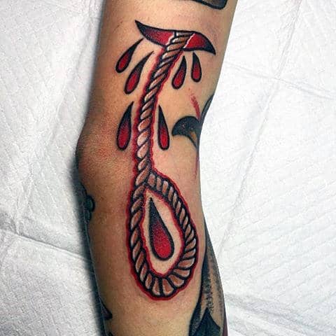 Guy With Blood And Rope Tattoo On Forearms
