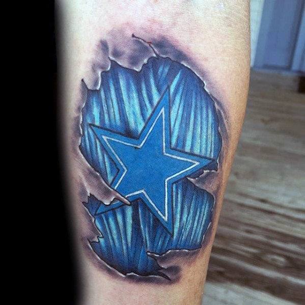 3D ripped skin tattoo on forearm revealing a bold blue star over a textured striped background, creating a striking layered look.