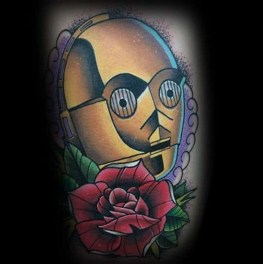 Neo-traditional C-3PO tattoo with bold outlines, vibrant colors, and a detailed red rose, blending Star Wars with classic tattoo artistry.