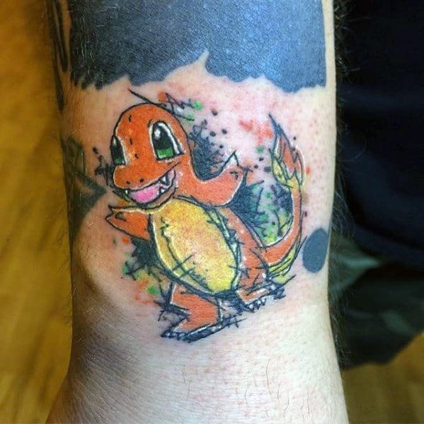 Sketch-style Charmander tattoo with vibrant splashes of orange, green, and black ink, giving it a hand-drawn, watercolor effect.