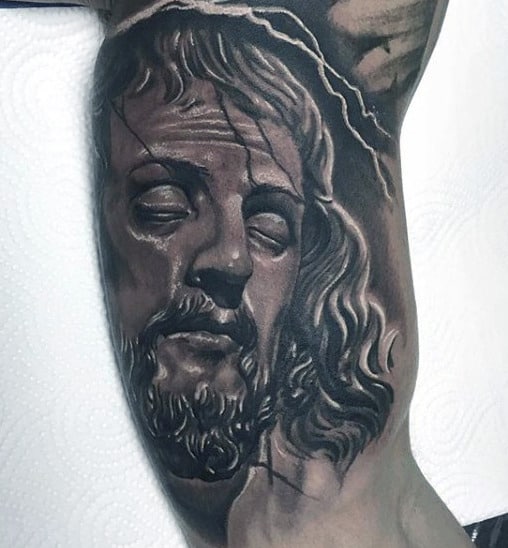 Guy With Christian Symbols Tattoo