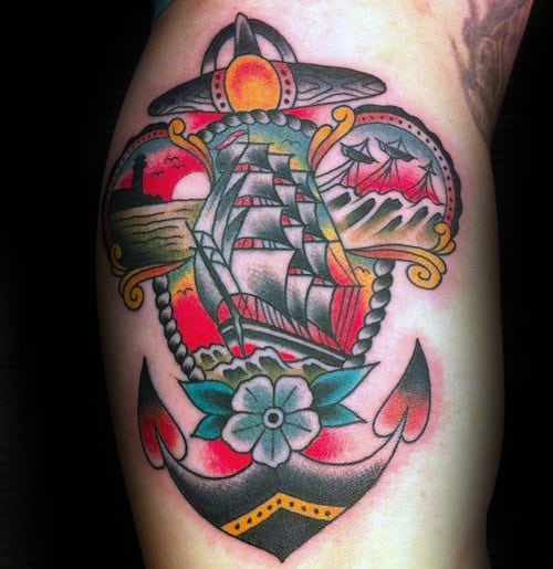 Guy With Colorful Traditional Anchor Ship Arm Bicep Tattoos