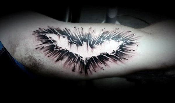 Guy With Cool Negative Space Batman Symbol Inner Arm Bicep Tattoo