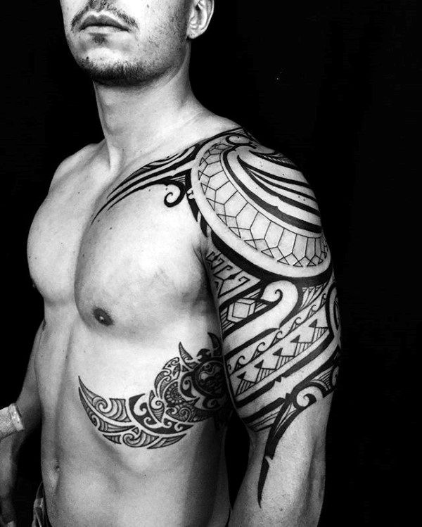 Guy With Cool Unique Tribal Rib Polynesian Tattoos
