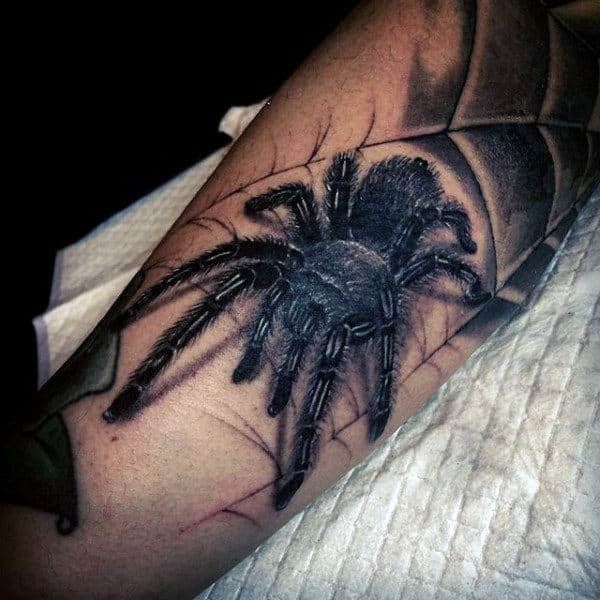 Guy With Crawling Grey Spider Tattoo On Legs