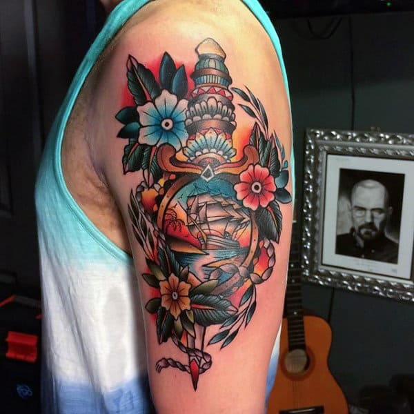 Guy With Dagger And Flowers Tattoo