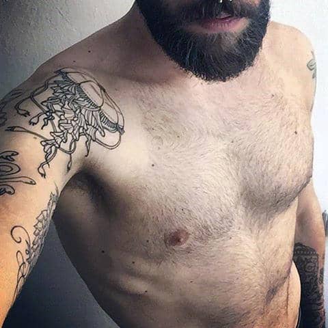 Guy With Dark Jellyfish Tattoo Arms