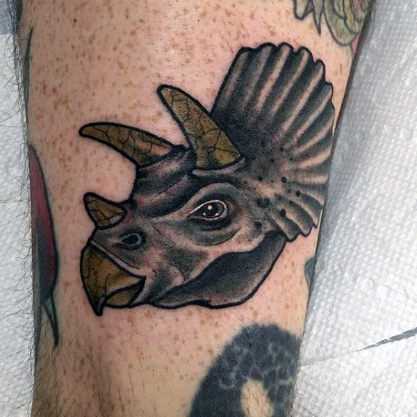 Guy With Dinosaur Tattoo On Ankle