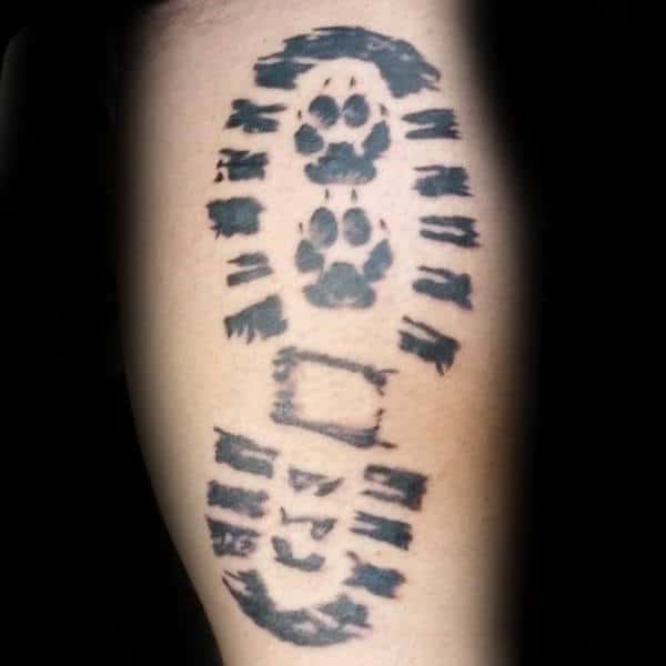 Guy With Dog Paw Shoe Print Tattoo On Leg Calf