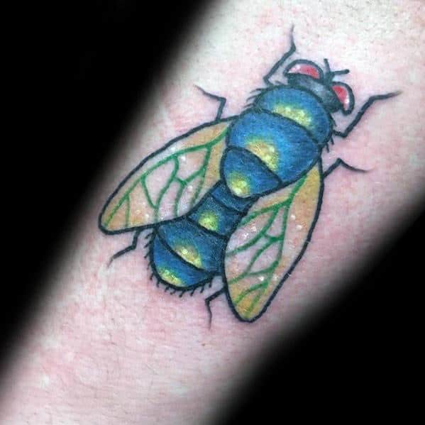 Vivid fly tattoo with a blue and yellow striped body, red eyes, and green-veined wings for a colorful, cartoon-inspired look.