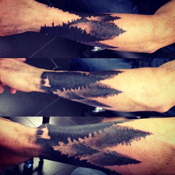 Guy With Forearm Tree Watercolor Tattoo Negative Space Wolf Design
