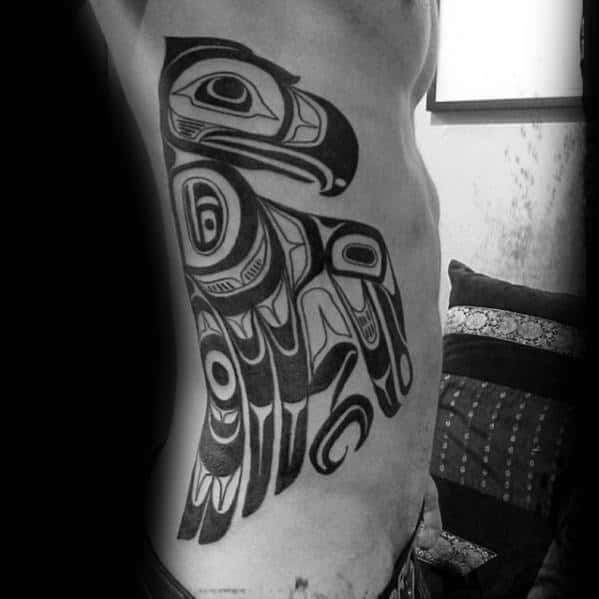 Guy With Full Rib Cage Side Tribal Bird Haida Tattoo