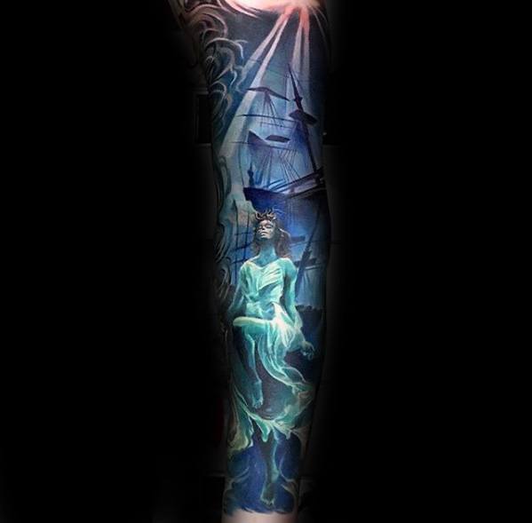 Ghostly underwater sleeve tattoo of a sunken ship and a glowing spirit woman in a flowing dress, illuminated by light from above.