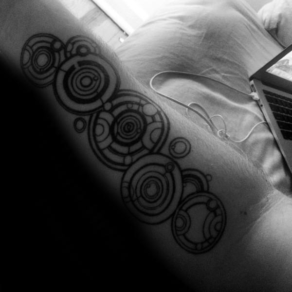 Guy With Gallifreyan Themed Inner Forearm Tattoo Design
