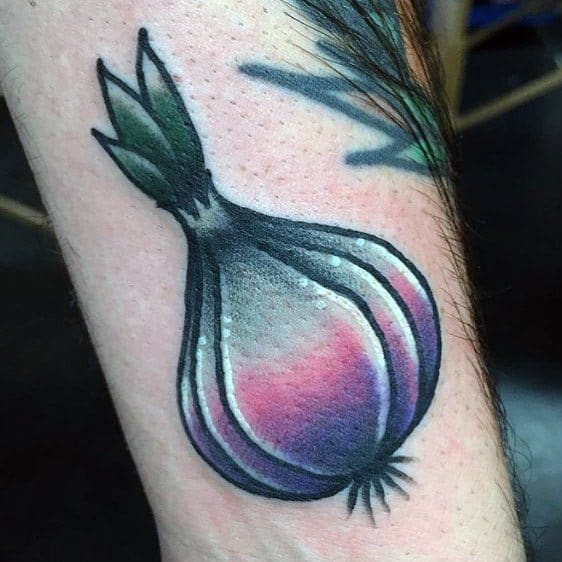 Vibrant garlic tattoo with bold black outlines, smooth shading, and purple hues, creating a modern and artistic botanical design.