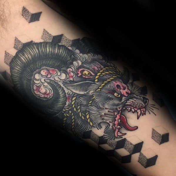 Tattoo of a snarling ram with geometric patterns on the background