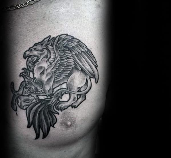 Guy With Griffin Shaded Chest Tattoo Design