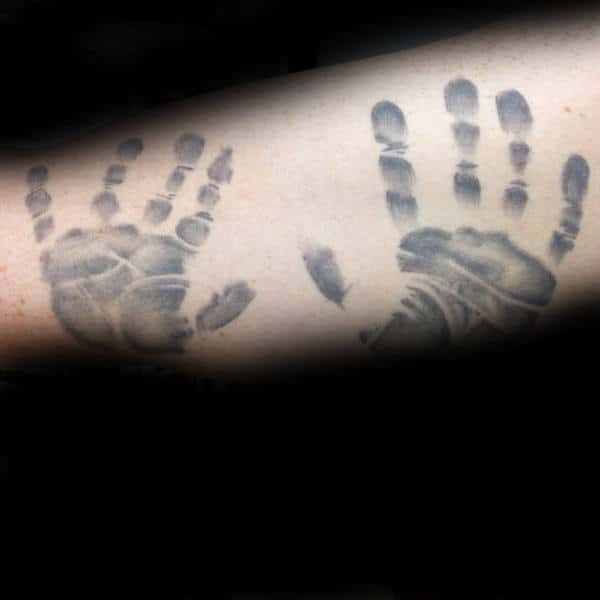 Guy With Handprints Of Children On Arms
