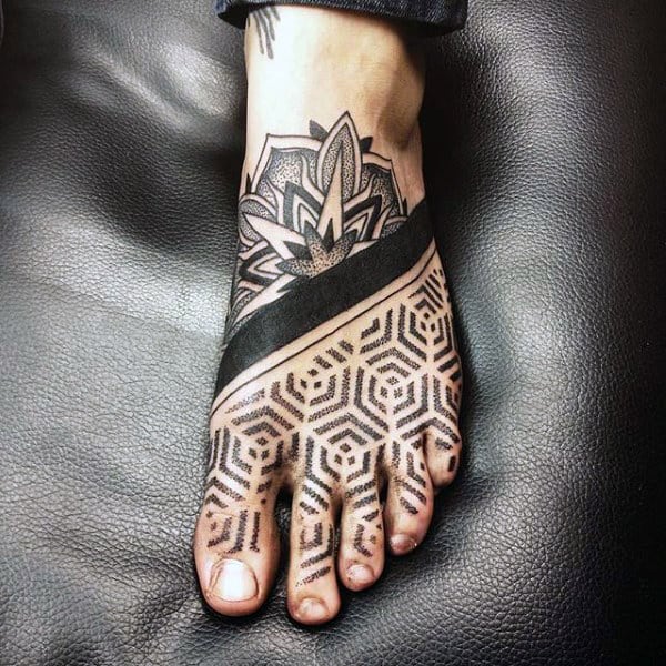 A foot tattoo featuring geometric patterns and a floral design covering the top of the foot