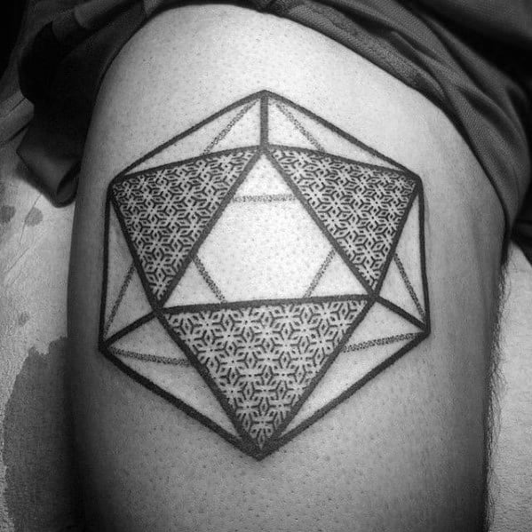 Icosahedron tattoo on thigh with bold outlines and intricate dot-patterned fill in selected facets, blending geometry and texture.