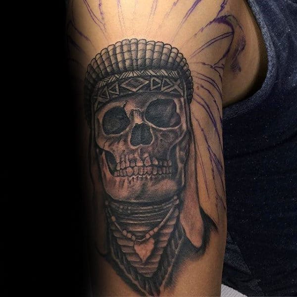 Guy With Indian Skull Upper Arm Tattoo In Shaded Grey Ink