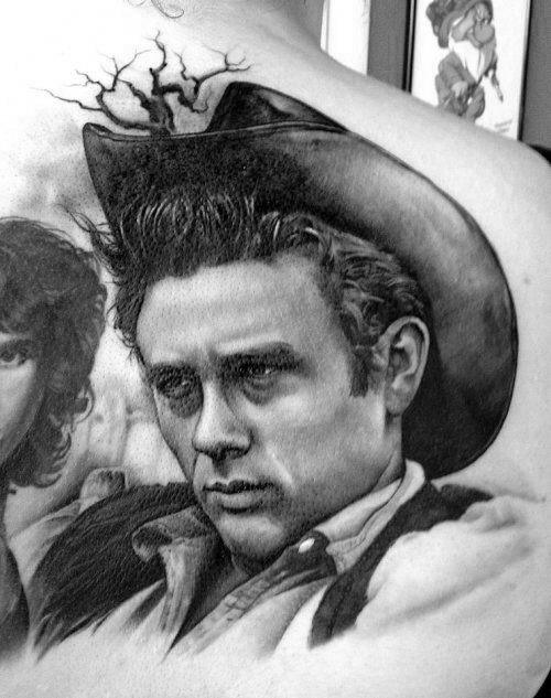 Realistic black and grey back tattoo of James Dean in a cowboy hat, inspired by his role in the movie *Giant*.