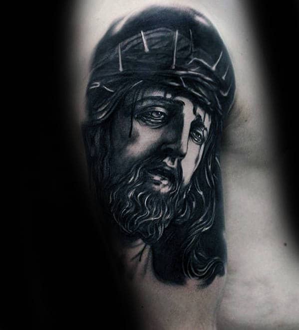 Guy With Jesus Dark Black Ink Shaded Arm Tattoo